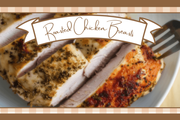 Closeup of sliced roasted chicken breasts on a white plate