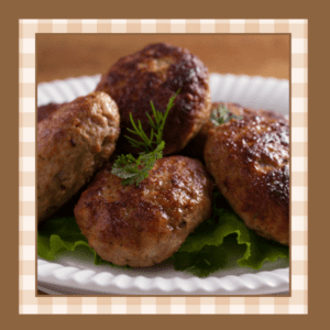 White plate stacked with sausage patties