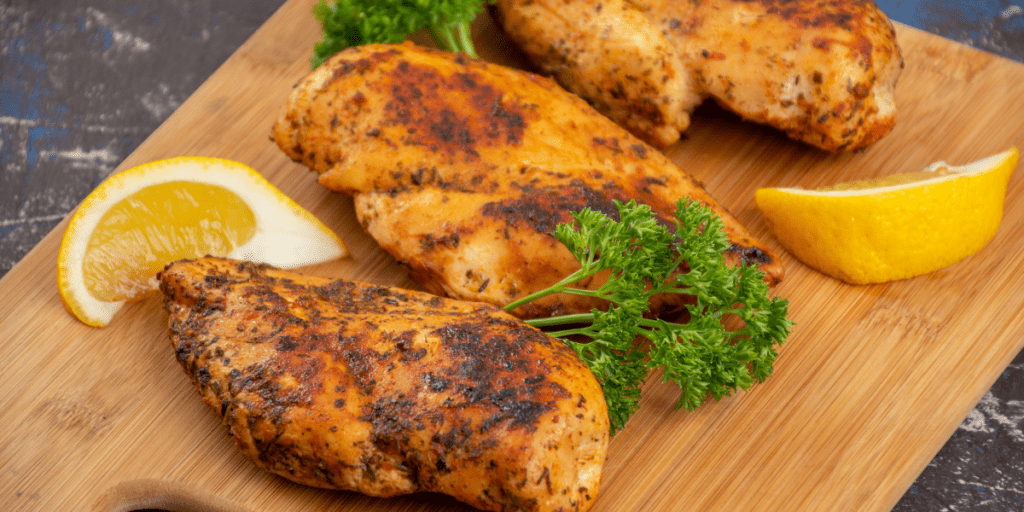 Roasted chicken breasts on a cutting board