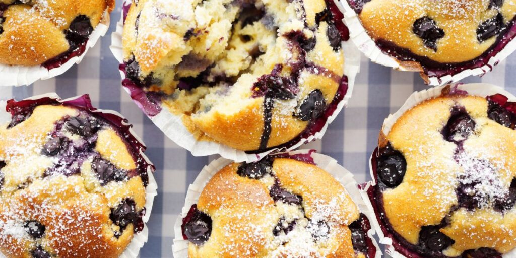 Blueberry muffins on a blue checked tablecloth