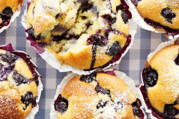 Blueberry muffins on a blue checked tablecloth