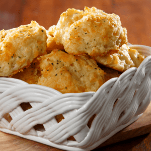 White ceramic basket holding a batch of biscuits