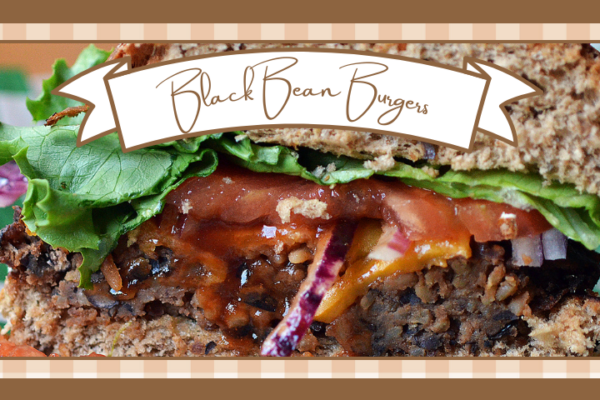 Black bean burger cut in half Burger is on a whole grain bun with lettuce and tomato