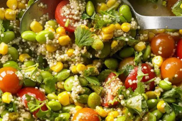 Wooden salad bowl with edamame quinoa salad