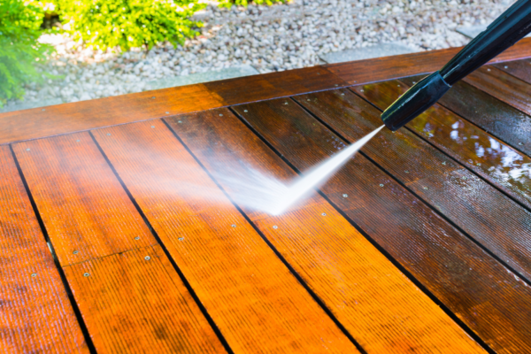 Exterior deck being power washed