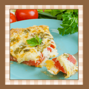 Slice of tomato pie on a light blue plate