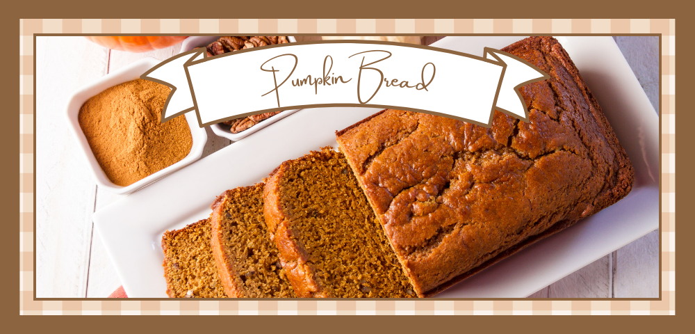 Loaf of pumpkin bread with three slices on a white plate
