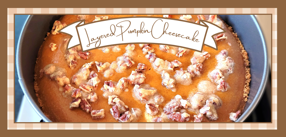 Whole layered pumpkin cheesecake with streusel topping in a springform pan