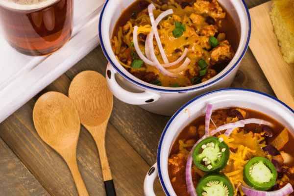 Turkey chili served in individual white crocks.