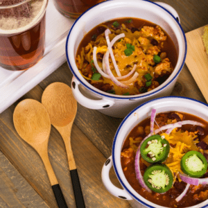 Turkey chili served in white crocks.