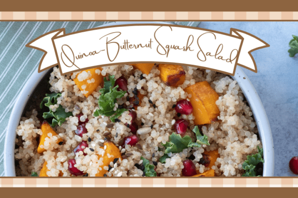 Bowl of quinoa butternut squash salad on a blue counter