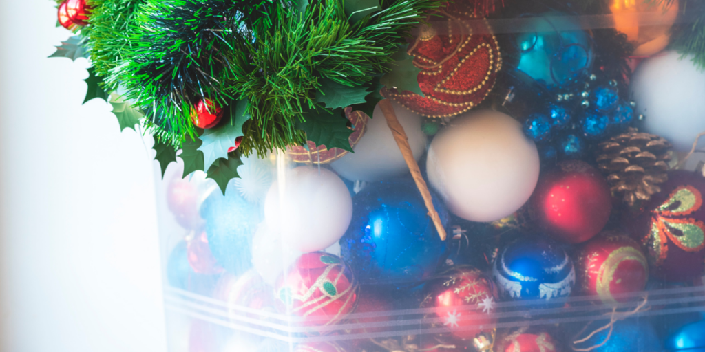 Christmas decorations in a clear bin