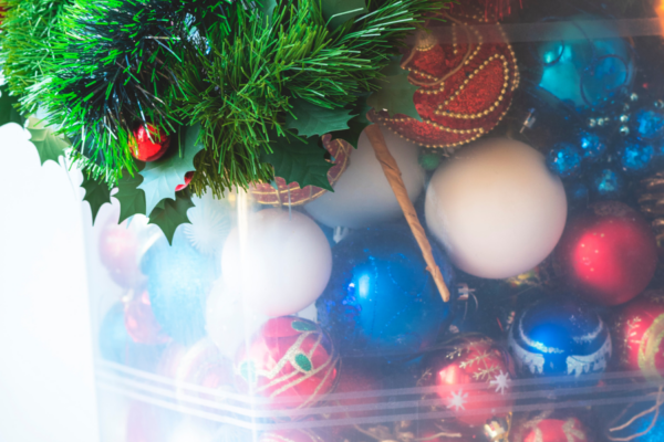 Christmas decorations in a clear bin