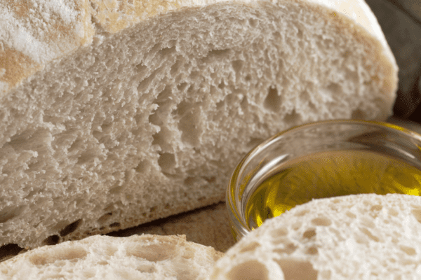 Italian Bread | The Granite Acorn Loaf of italian bread with olive oil for dipping