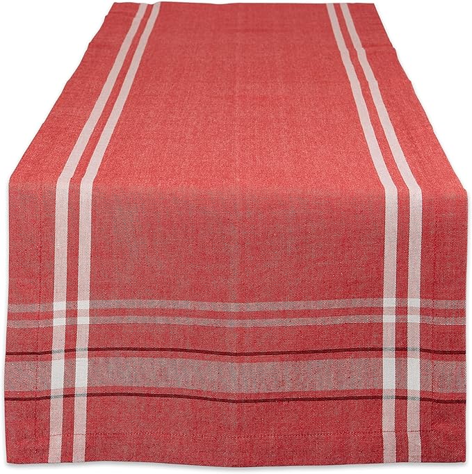 Red table runner with cream stripes down the sides.