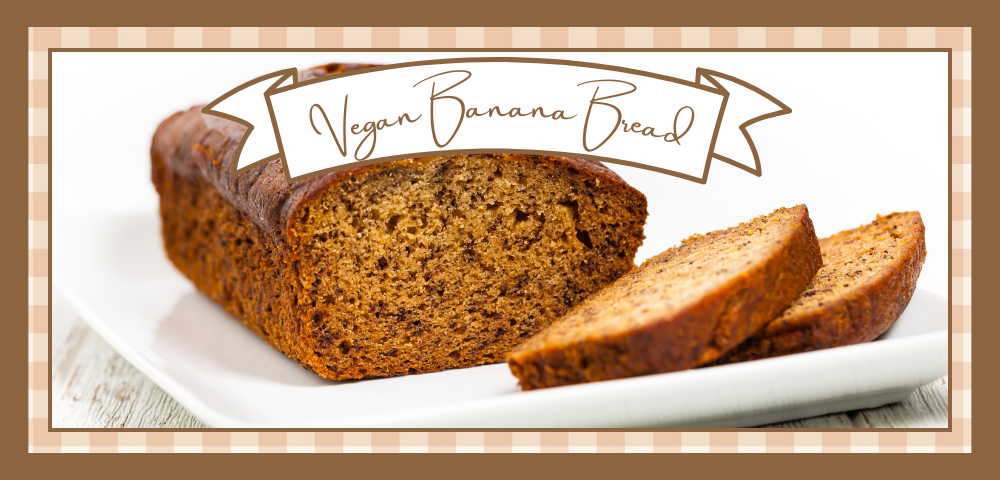 Loaf of banana bread with two slices removed to show the inside of the bread