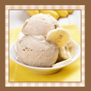 Banana-Ice-Cream-Recipe | The Granite Acorn Closeup of a dish of banana ice cream on a yellow background Two scoops of ice cream are garnished with fresh banana slices