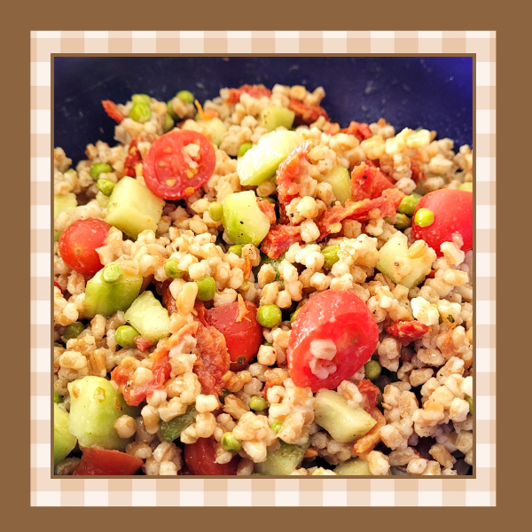 Italian-Farro-Recipe | The Granite Acorn Closeup of a bowl of italian farro salad