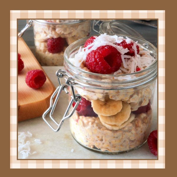 Overnight-Oats-Recipe | The Granite Acorn Mason jar of overnight oats with fresh raspberries and shredded coconut