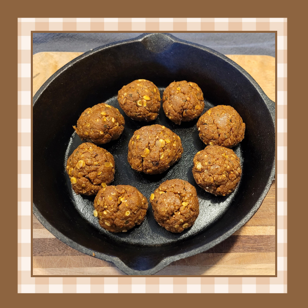 Vegan-Meatballs-Recipe | The Granite Acorn Skillet of vegan italian meatballs on a wood cutting board