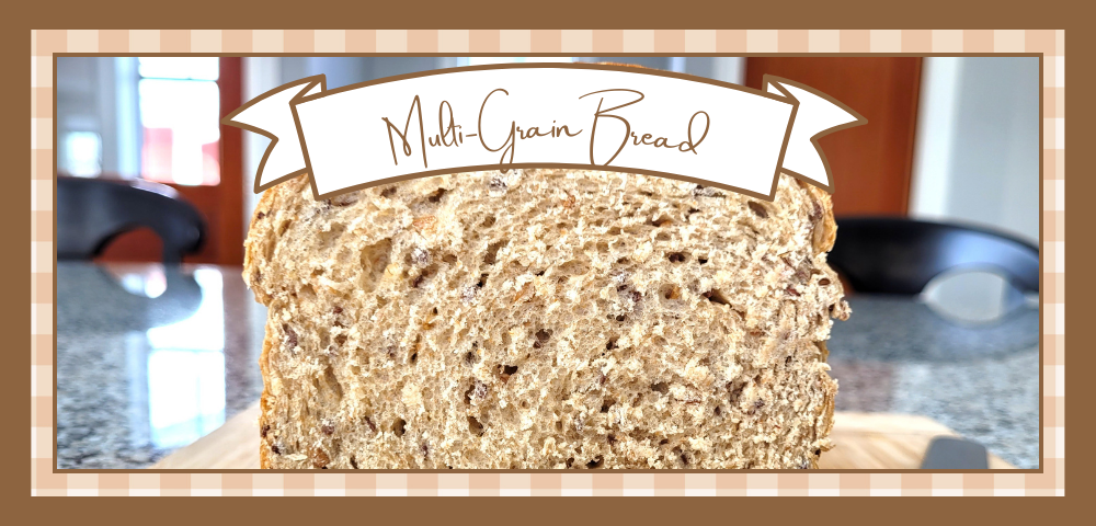 Multi-Grain-Bread-Banner | The Granite Acorn Loaf of multigrain bread sliced so it's shows the inside