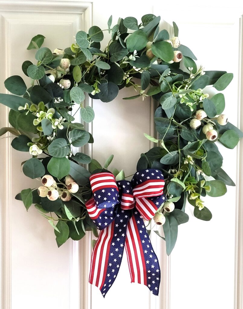 Memorial-Day-Front-Door-Inside | The Granite Acorn Eucalyptus wreath with white berries and a bow with an american flag print