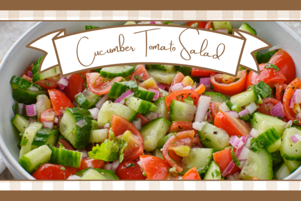 Cucumber and tomato salad in a white bowl with diced cucumbers tomatoes red onion and herbs banner reads 'cucumber tomato salad'